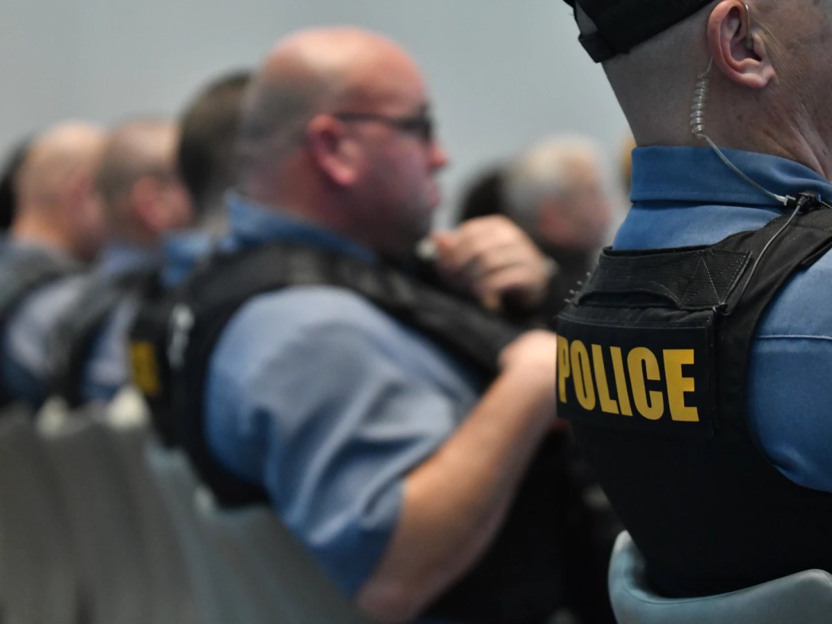 Row of KCPD police officers in chairs