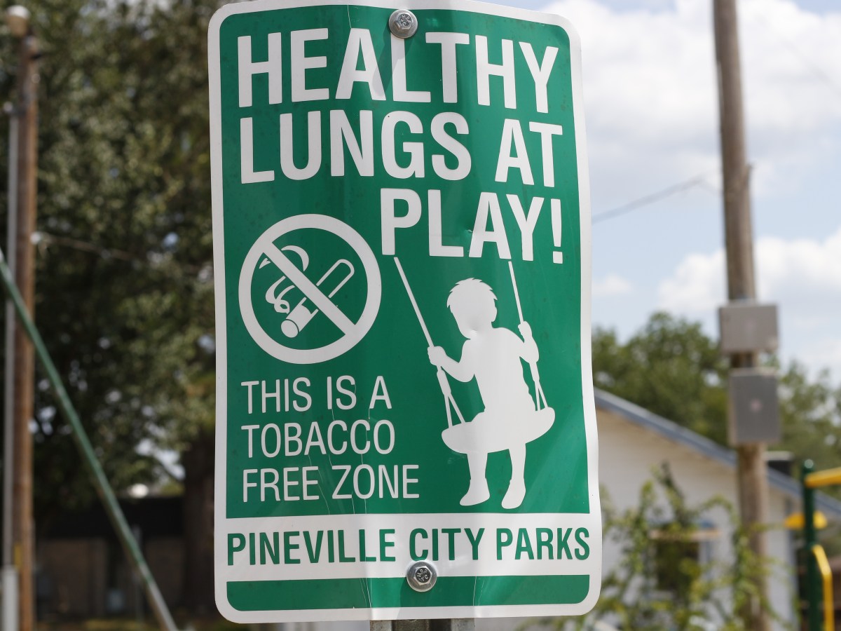 A sign at a playground reads: Health Lungs at Play