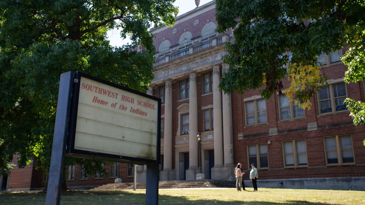 People stand in front of Southwest High School