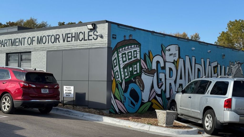 The outside of Grandview's DMV with a mural covering one side of the building.