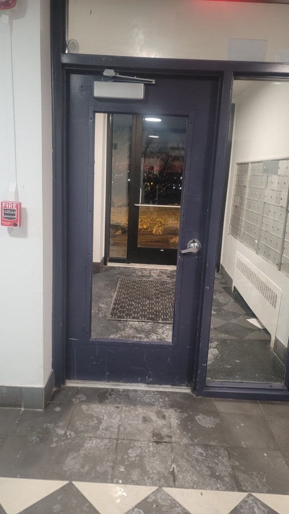 The glass from the second entrance door to 817 Jefferson St. is completely gone, leaving a gaping entrance to the building.  