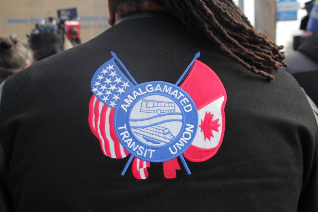 Back of a person's shirt that says Amalgamated Transit Union Shirt. 