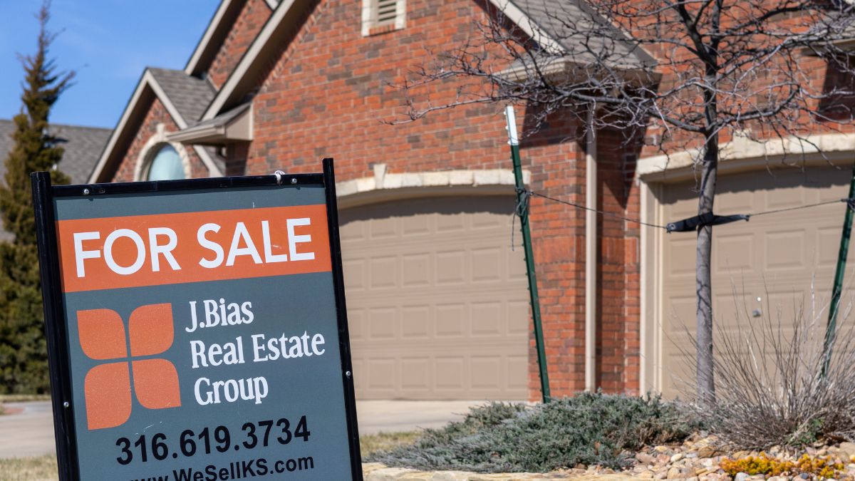 A for sale sign in front of a home