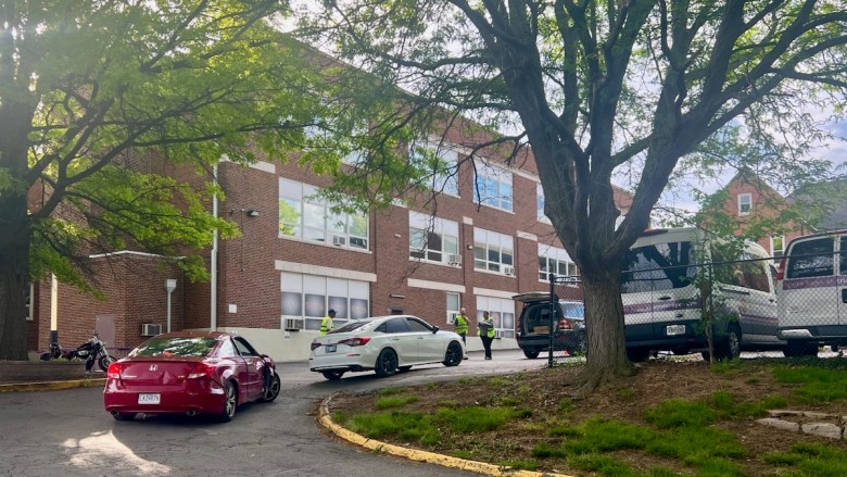 Cars waiting to pick up free food at Redemptorist Social Services Center in midtown. Organizers said the lines will be even longer if SNAP benefits are cut.