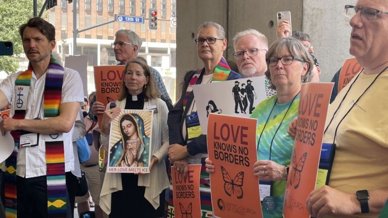 Clergy members protesting mass deportation in Kansas City.