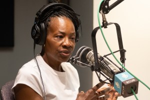 Candidate speaking into a KCUR microphone on Up-to-Date.