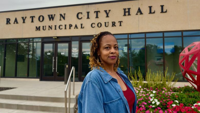 Latrice Thomas standing in front of Raytown City Hall and Municipal Court.
