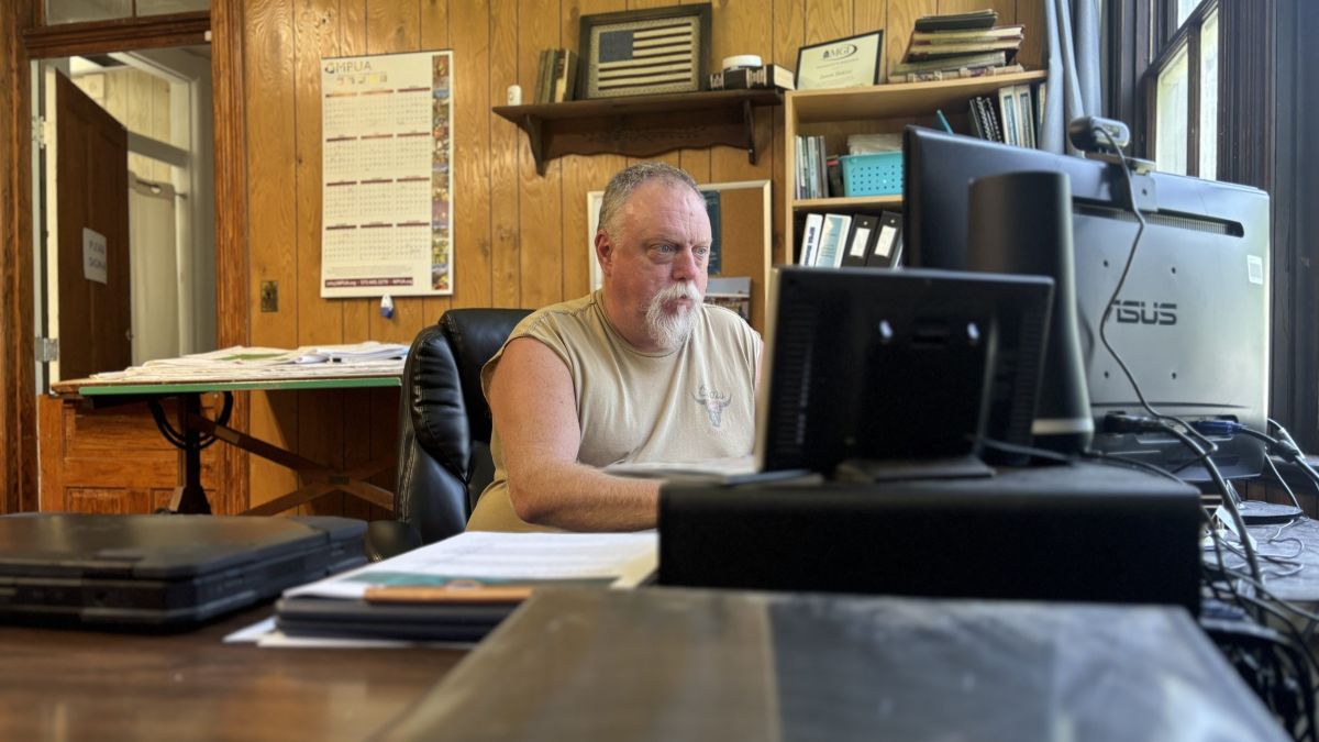 Berger City Clerk Jason Eaklor sits at his desk in Berger City Hall.