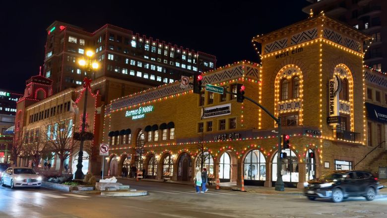 The Country Club Plaza Barnes and Noble and West Elm building, decorated in holiday lights at night