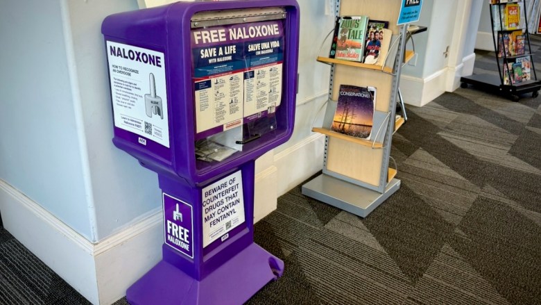 A dispensary box at the Westport Library provides free naloxone, a medication that can reverse an opioid overdose.