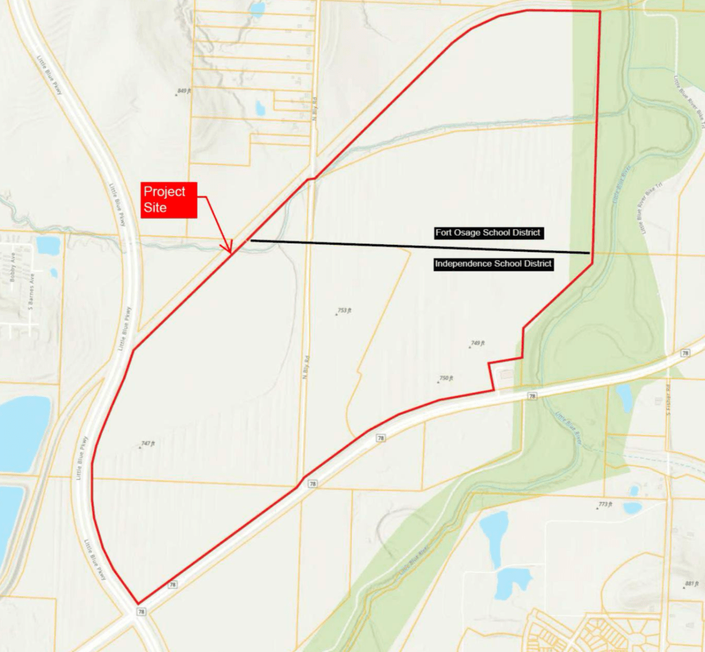 A street map of eastern Independence, Missouri showing the proposed Nebius project site outlined in red near Little Blue Parkway and Bly Road. A black horizontal line cuts through the site, labeled "Fort Osage School District" above and "Independence School District" below, illustrating that the campus spans two school district boundaries.
