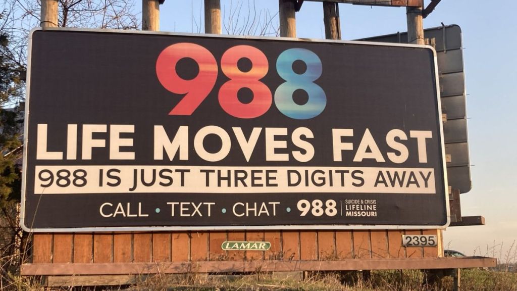 A billboard advertising 988 alongside Highway 63 near the Ashland, Missouri, exit.
