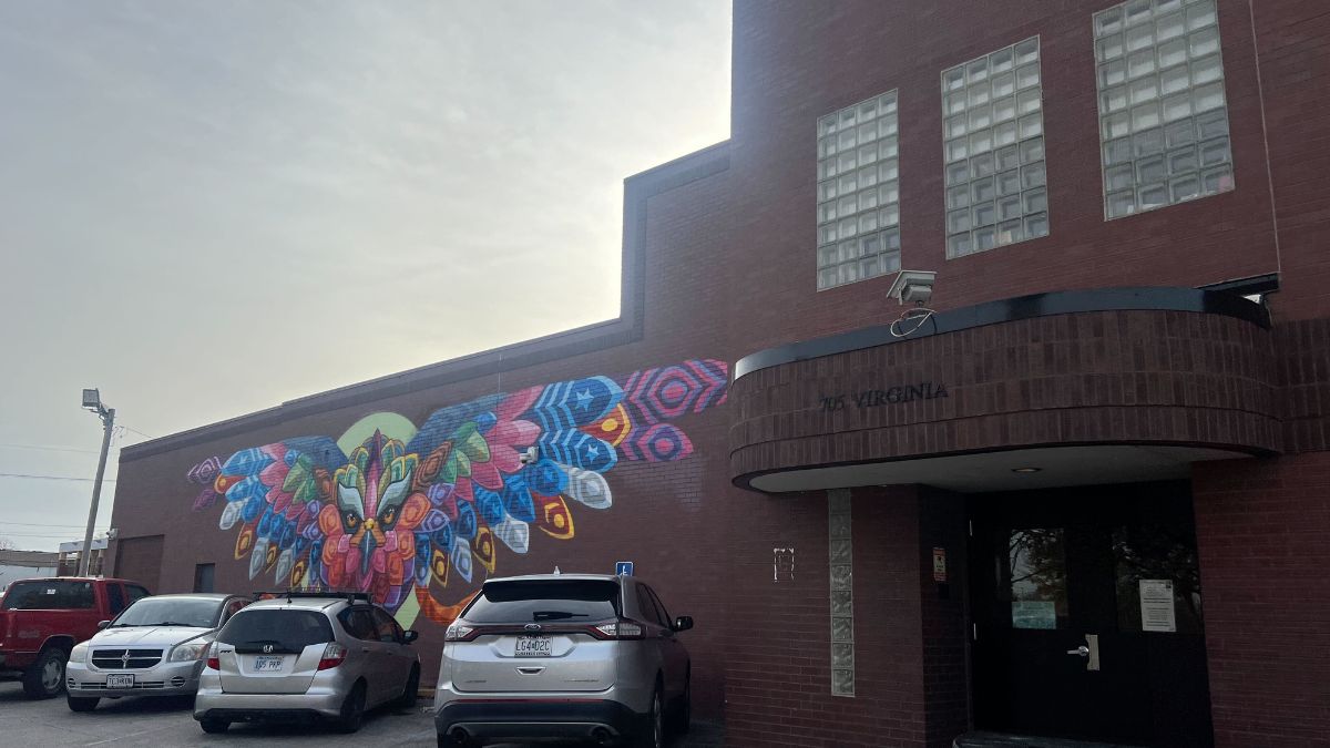 The brick exterior of Hope Faith Homeless Assistance Campus in Kansas City features a multi-colored mural.