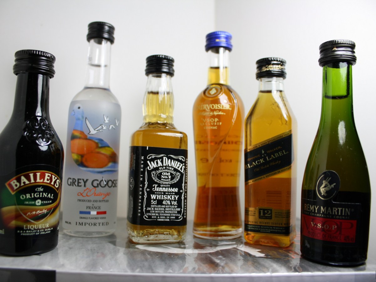 A line of six mini liquor bottles.