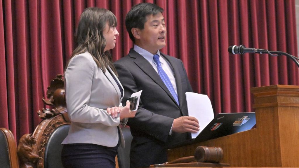 Missouri House Speaker Jonathan Patterson (R-Lee's Summit) and Rep. Ashley Aune (D-Kansas City) talk after the passage of HJRs 173 and 174.