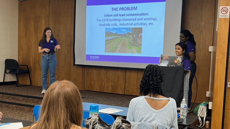 Kansas State University graduate students in the Department of Agronomy present to event attendees gathered on April 28, 2026.