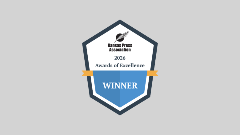 Badge with the Kansas Press Association logo and text that says "2026 Awards of Excellence Winner"