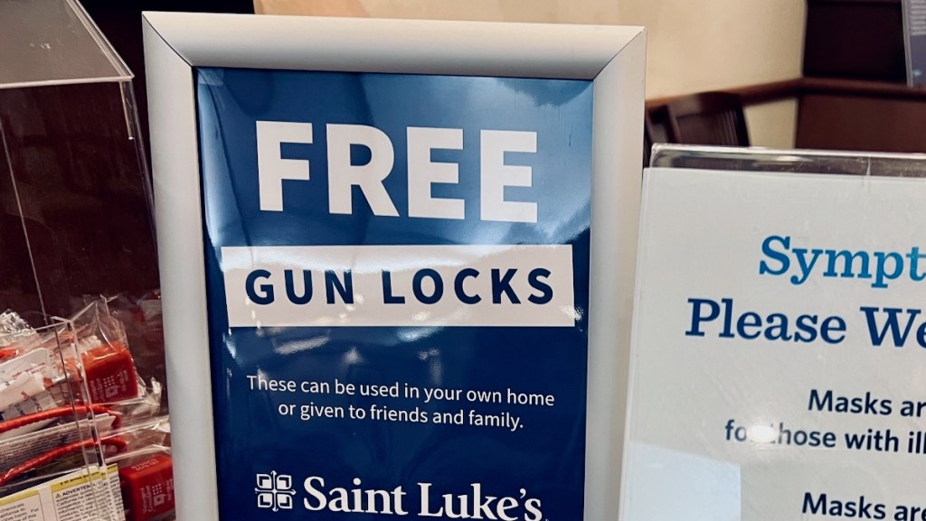 Sign at a St. Luke's Hospital doctor's office offering patients free gun locks.