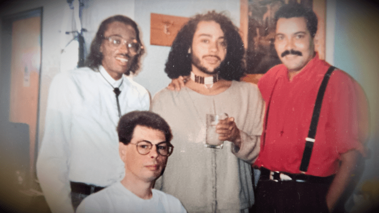 Roberto Archuleta in the center of a group of three other people in a photo taken in the early 1990s.