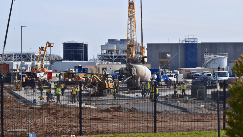 Workers pour concrete at the Google data center campus near Worlds of Fun in March 2026.(Thomas White/The Beacon)