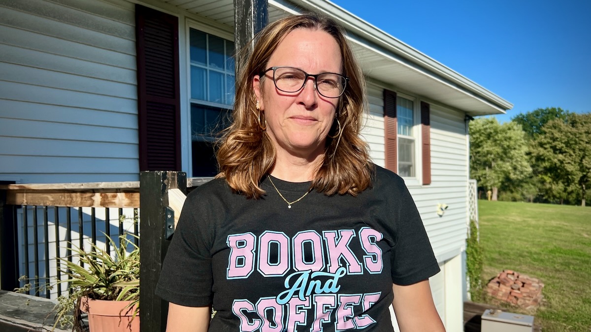 A picture of Karrie Krause standing outside her house in Raytown.