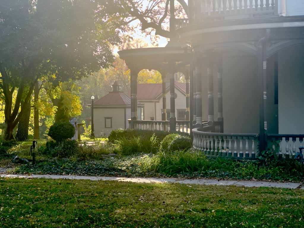 The curved balcony of the Bingham-Waggoner estate, with some of the side garden