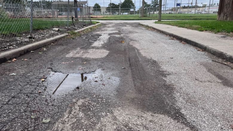 Potholes on an alleyway behind Armourdale Community Center